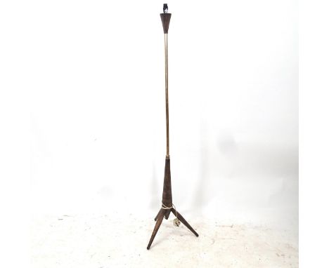 A mid-century standard lamp on tripod base 