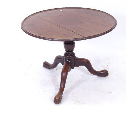 A Georgian mahogany circular low table on tripod base, W80cm, H60cm 