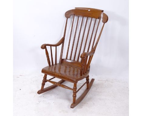 An elm-seated stick-back rocking chair 