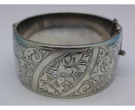 A wide silver bangle