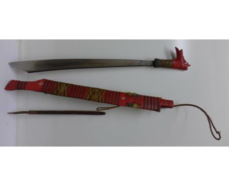 A Deyak head hunters knife with additional knife down the scabbard, with rattan binding