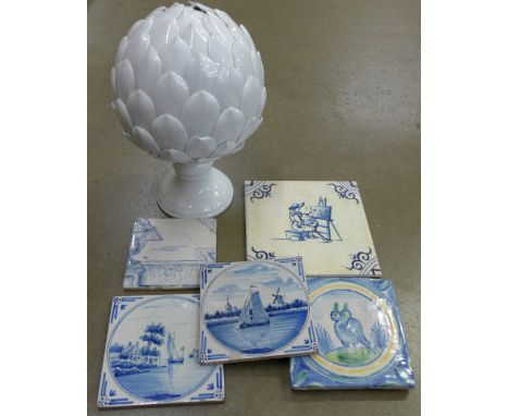 Five blue and white tiles, four Delft and one other and an artichoke shaped finial