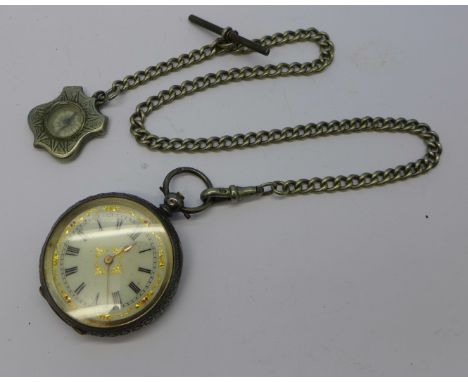 A lady's silver fob watch and chain with compass fob
