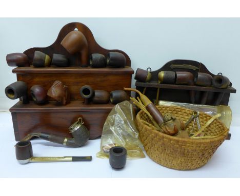 Two pipe racks and pipes and other pipes, a lighter and cheroot holder
