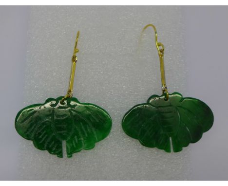 A pair of carved jade earrings