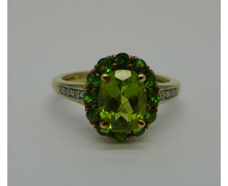 A 9ct gold, peridot and diamond cluster ring, 2.5g, M