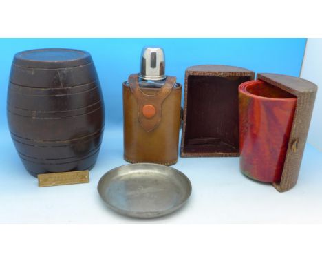 A wooden barrel with lid made From The Decking of The Mauretania, a set of four graduated Bandalasta Ware beakers, cased, a d