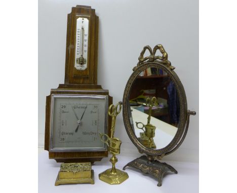 A gilt metal oval mirror, barometer, a stamp box and candle snuffers with stand