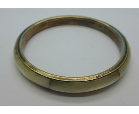 A hallmarked silver and mother of pearl bangle