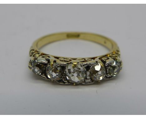 An 18ct gold and five stone diamond ring, 3.2g, M