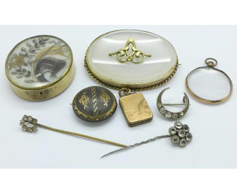Four Victorian brooches, one a/f, a locket, pendant and two stick pins