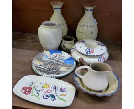 A collection of Poole pottery and motto ware Devon pottery, (11)