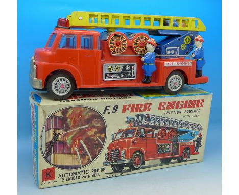 A plastic and tin plate fire engine, boxed, made in Japan