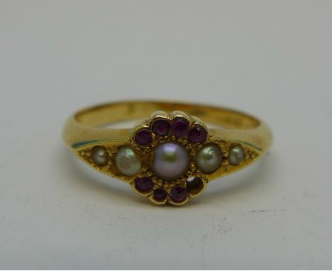 An 18ct gold, ruby and seed pearl ring, 3.9g, P, (lacking one red stone)