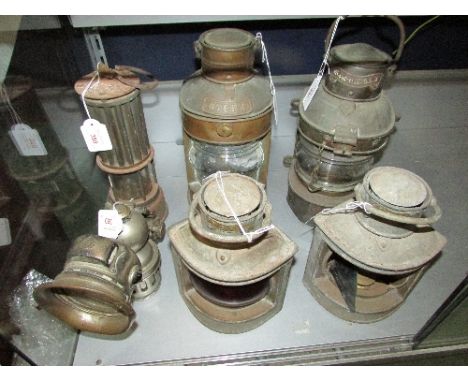 A Regalite carbide bicycle lamp, a miner's lamp manufactured by The Premier Lamp and Engineering Co Leeds, and four ships lam