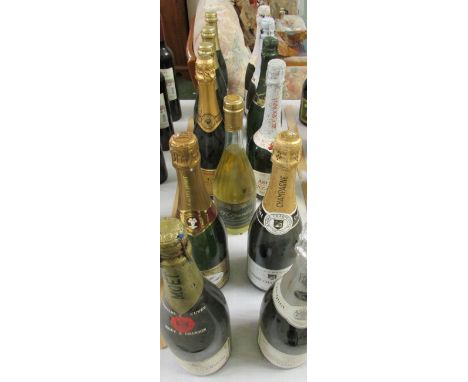 Four bottles of Champagne (Moet & Chandon, Veuve Clicquot, Andre Carpentier and J. de Telmont) and nine bottles of sparkling 