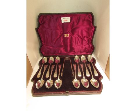 A set of twelve Victorian silver tea spoons with chased handles and monogrammed finials MN, each marked for Exeter, 1857, mak