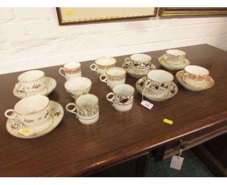 Two Barr, Flight and Barr Worcester porcelain tea cups and saucers painted in brown and gilding on white ground with floral s