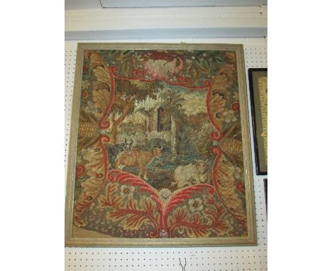 A wool tapestry depicting horned cattle before ruins within a foliate border, probably late 19th century and in a modern fram