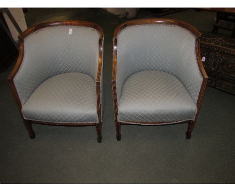Pair of Edwardian tub chairs with boxwood stringing and compass inlay to the mahogany frames, on front splayed legs, more rec