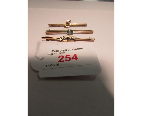 9ct gold bar brooch set with pale aqua marine; 9ct gold bar brooch set with amethyst in hoop setting; and a gold plated bar b