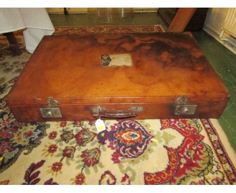 Car travel case or trunk finished in brown leather with black velvet lined interior, the locks marked Capitol Brand, (82cm x 