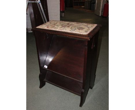 Early 20th century dark mahogany harmonium stool with upholstered top and two slanted tiers, sectional sides and ogee feet (h