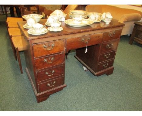Mahogany partner's type desk of smaller proportions, to each side a central drawer with four side drawers, an extension slide