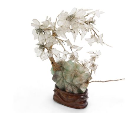 Early 20th century Chinese carved fluorite and crystal table lamp, depicting a blossoming tree on a rocky outcrop, on a carve