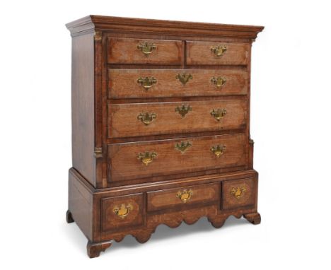 George III oak and mahogany banded chest on stand, moulded cornice over two short and three long drawers, shaped brass handle