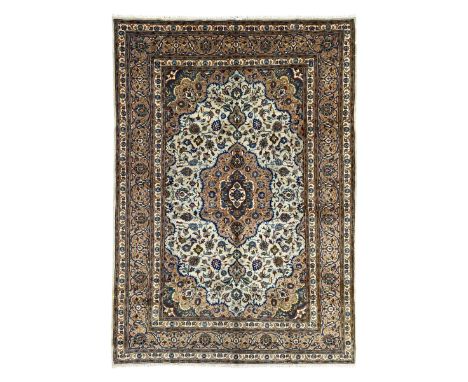 Persian Kashmar pale green ground rug, shaped central medallion decorated with stylised flower heads, the surrounding field w