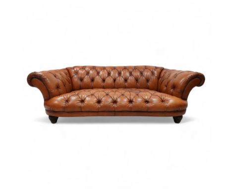 Tetrad - 'Oskar' grande three-seat sofa, Chesterfield shape with rolled arms, upholstered in buttoned tan leather, on turned 