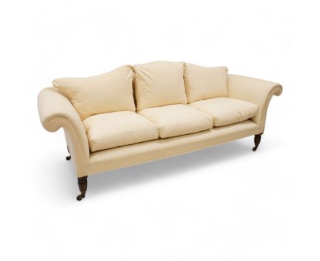 Grande three-seat camelback sofa, upholstered in calico base layer, on turned feet painted to resemble rosewood, fitted with 