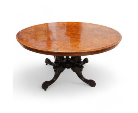 James Shoolbred & Co. (London: 1814-1934) - Victorian figured walnut loo table, oval moulded top inlaid with scrolling foliat