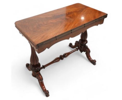 Victorian figured mahogany card table, rectangular swivel and fold-over top with rounded corners and baize lined interior, sh