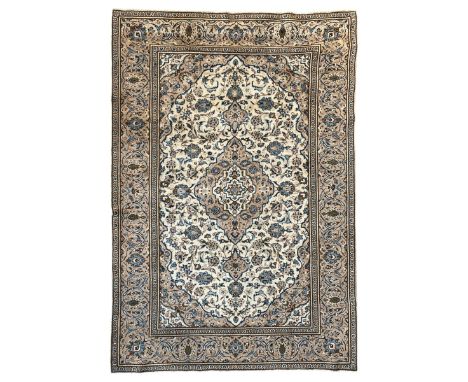 Persian Kashan ivory ground rug, the field decorated with interlacing branches and palmettes, central floral design pole meda