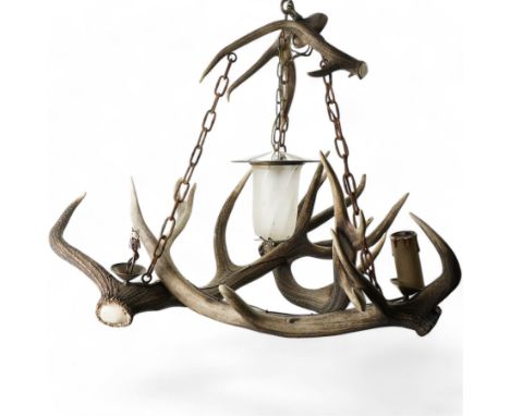 Deer antler chandelier, of triangular form, with four fitted lights H76cm