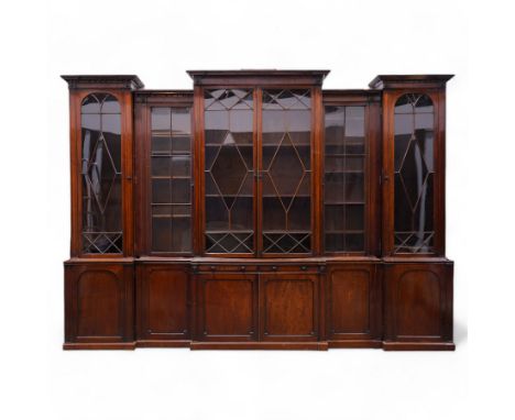 Large Georgian mahogany library bookcase, projecting moulded cornice with row of globular mounts, adjustable shelving enclose