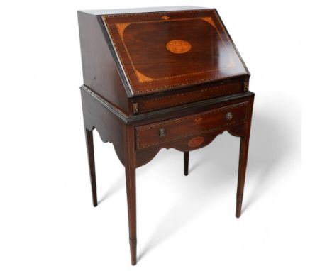 19th century inlaid mahogany bureau on stand, sloped moulded lid inlaid with shell motifs and parquetry bands, the interior f