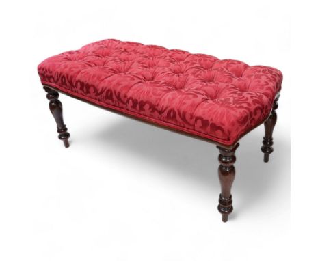 Victorian design mahogany footstool, rectangular form, the seat upholstered in red buttoned fabric with stylised foliate patt