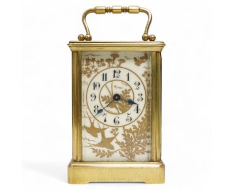 French - Early 20th century 8-day brass carriage clock in a corniche case, with rectangular glazed  panels and an oval viewin