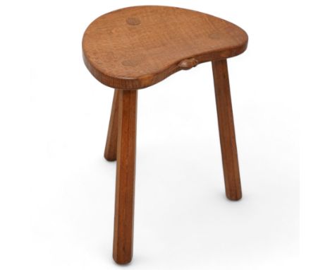 Mouseman - oak three-legged stool, dished kidney-shaped seat on three octagonal splayed supports, carved with mouse signature