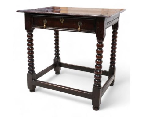 17th century oak side table, rectangular two-plank top with moulded edge, over a single drawer with moulded facia, raised on 