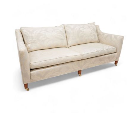 Duresta - Grande hardwood-framed three-seat sofa, upholstered in pale fabric decorated with repeating foliate pattern, on squ