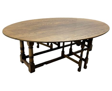 Large 18th century design oak wake or dining table, oval drop-leaf top, turned supports with double gate-leg action base, uni