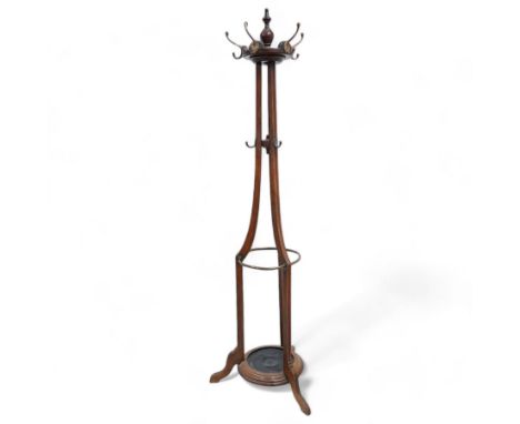 Late 19th century oak hat and coat hallstand, on three shaped and moulded supports with out splayed feet, fitted with hooks a