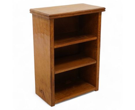 Mouseman - small adzed oak bookcase, moulded rectangular top over two adjustable shelves, solid end supports, relief carved w