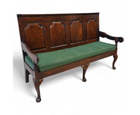 18th century oak settle or hall bench, moulded cresting rail over quadruple fielded panelled back, shaped arms over loose squ