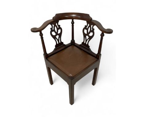 George III mahogany corner elbow chair, curved back rest and shaped arms with scroll carved terminals, on turned supports and