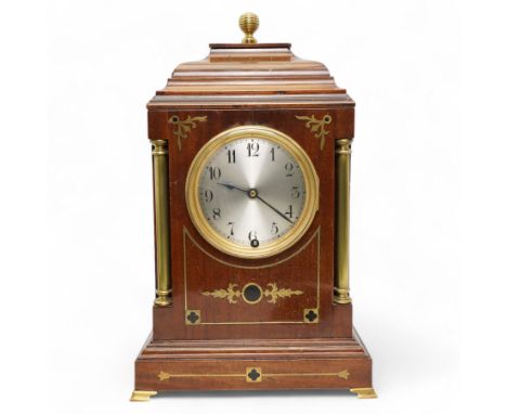 Edwardian- Early 20th century 8-day mahogany mantle clock, with a stepped pediment and brass finial, recessed brass pilasters